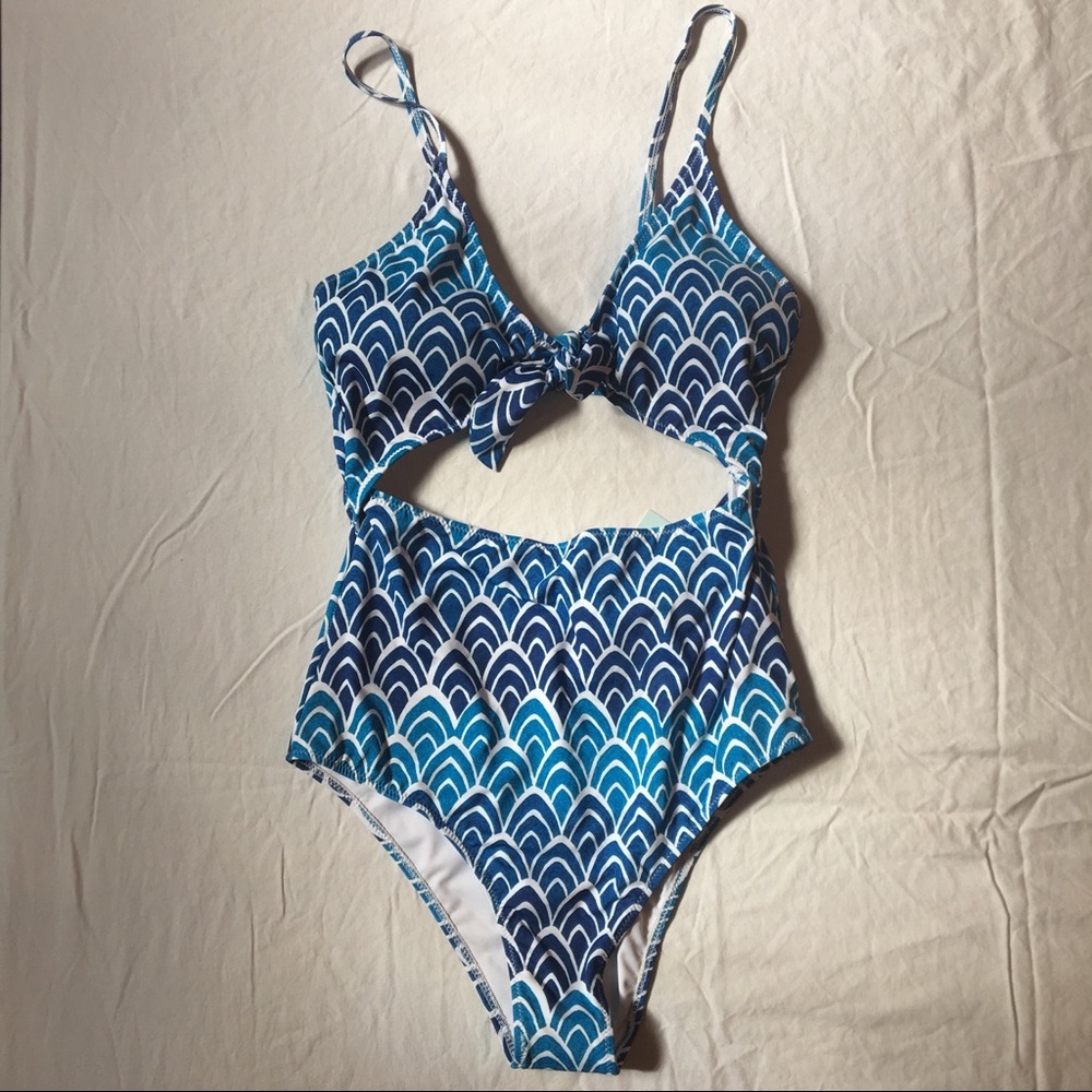 One piece swimsuit with cutout.